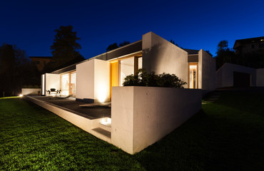 beautiful modern house in cement, night scene