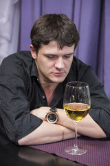 young man holds wine tasting in the restaurant
