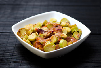 Bowl of cooked slices of zucchini and onions