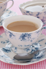 English breakfast tea with milk in floral china