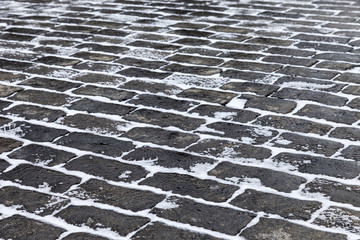 Fototapeta premium Grey paving stones of the Red square in Moscow in winter time as