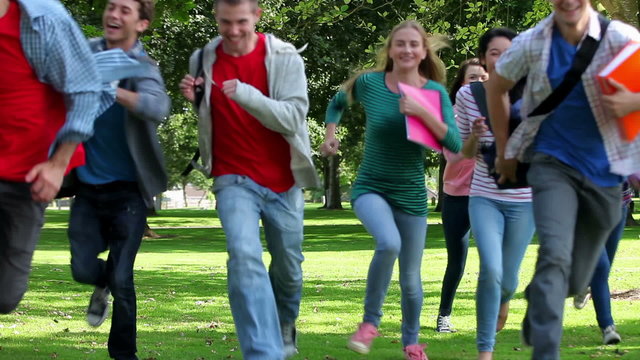 Students running towards camera together