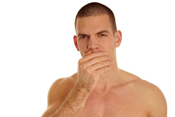Naklejka premium Coughing sick shirtless young man on a white background.