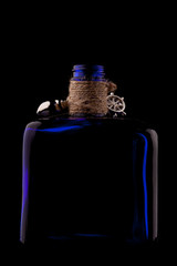 Blue bottle of tequila with decor