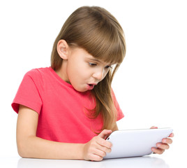 Young girl is using tablet