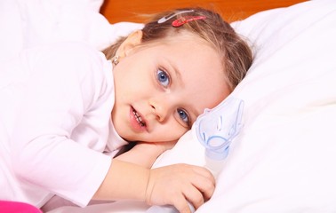 Little girl resting after treatment with aerosol