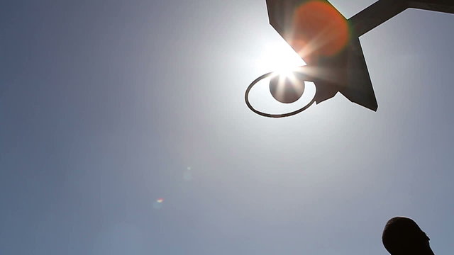 Slow motion basketball player silhouette scoring a lay up