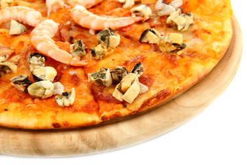 Delicious pizza with seafood on wooden stand isolated on white