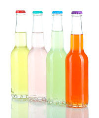 Drinks in glass bottles isolated on white