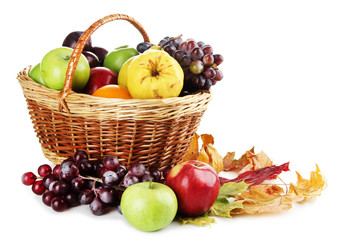 Different fruits with basket and yellow leaves isolated on