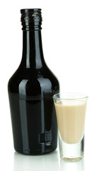 Baileys liqueur in bottle and glass isolated on white