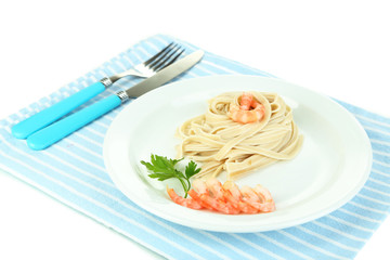 Pasta with shrimps on white plate, isolated on white