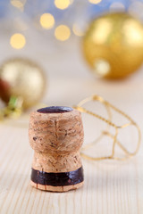 Champagne cork on Christmas lights background
