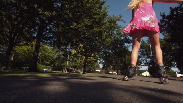 Toned blonde skating in park