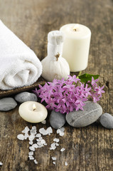 Fototapeta na wymiar Aromatic spa set with candle , tropical flower, massage oil