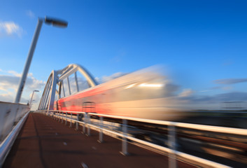 Train speeding over a bridge