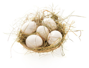 Naklejka na ściany i meble Eggs, hay in a bast basket
