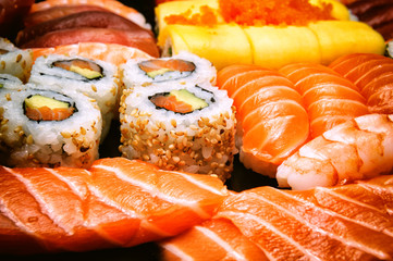 Close-up on sushi, sashimi and california rolls