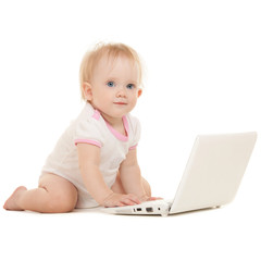 Cute baby with laptop on the white background
