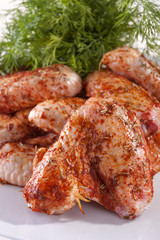 .fresh chicken wings in sauce ready for frying