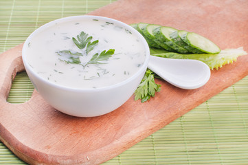 cold cucumber soup with slices of cucumber