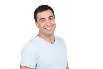 Confident smiling Indian man in blue T-shirt.