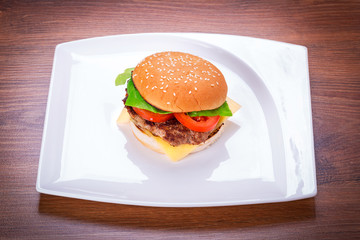 Hamburger with grilled beef, cheese and vegetables