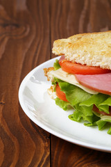 toasted sandwich with ham, cheese and vegetables