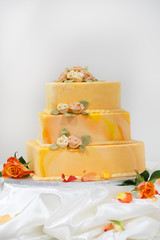 Wedding cake in yellow and orange.