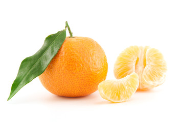 Mandarin or tangerine with leaves and peeled one