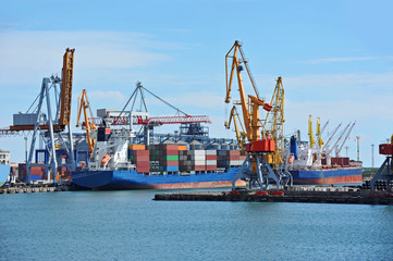 Container stack and ship under crane bridge
