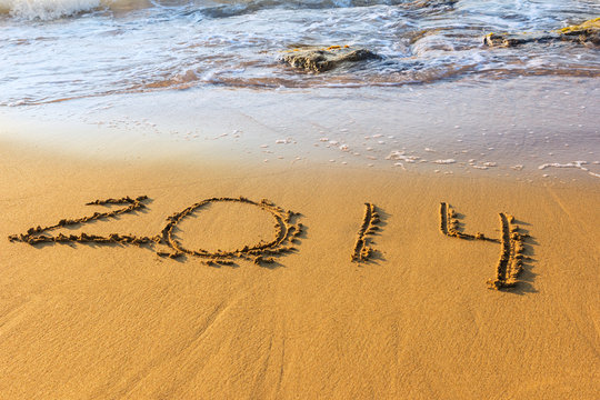 Date of new year on sand in surf