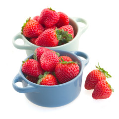 strawberry in bowls on white
