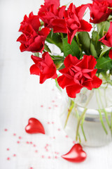 red roses with heart decoration for gift card