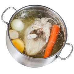 boiling of chicken soup isolated on white