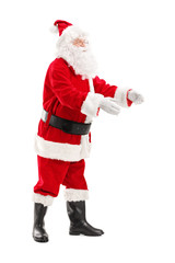 Full length portrait of a Santa Claus about to take something