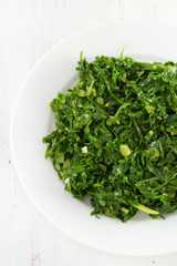 boiled cabbage on white plate
