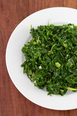 boiled cabbage with garlic on plate