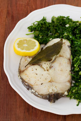 boiled fish with lemon and boiled cabbage