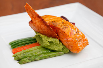 Fillet sea bass meuniere with vegetable and potatoes.