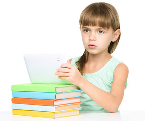 Young girl is using tablet