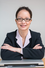 Woman with closed laptop