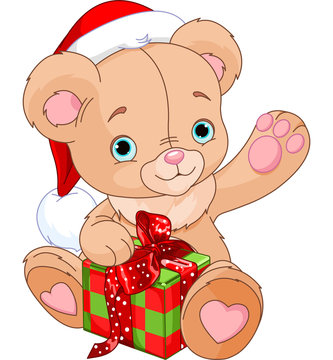 Christmas Teddy Bear holding gift