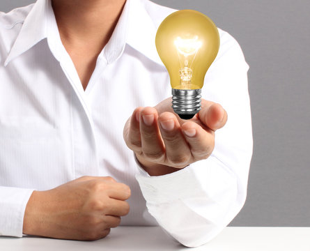 Ideas light bulb in  hand