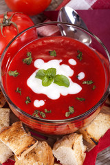 delicious homemade tomato soup with cream and basil