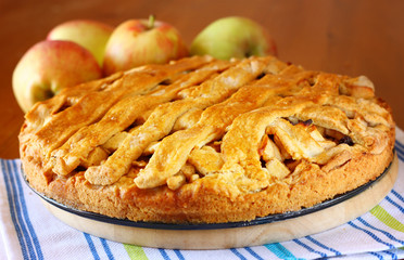 homemade apple pie on wooden table