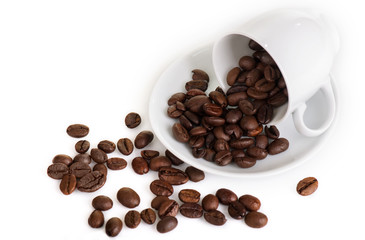 Cup with coffee beans isolated on white