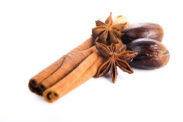 Star anise with cinnamon sticks isolated on white