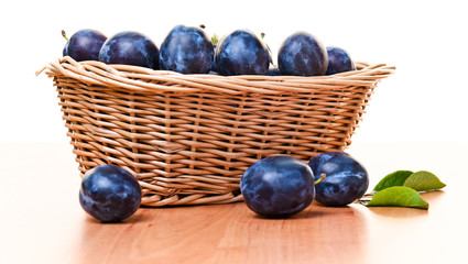 plums in basket