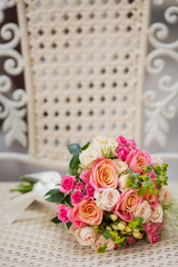 Wedding bouquet with roses on a bench